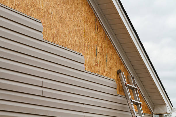 Professional Siding Replacement technician working in Concord, MA